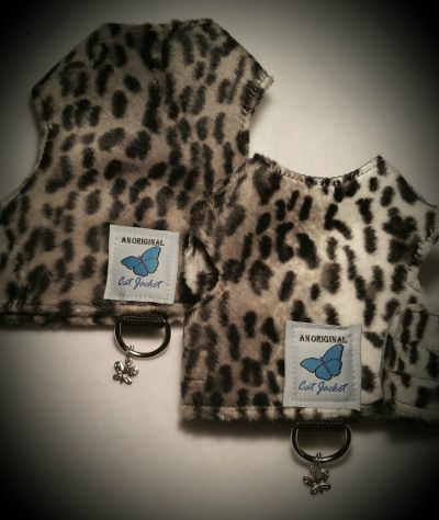 Two faux fur leopard print design cat walking harnesses from Butterfly Cat Jackets