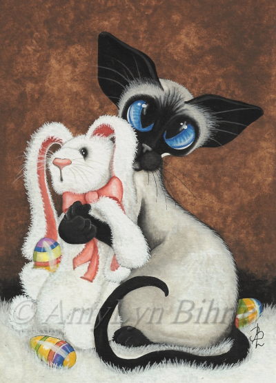 Blue-eyed Siamese cat hugging an Easter teddy bear. Image by AmyLyn Bihrle