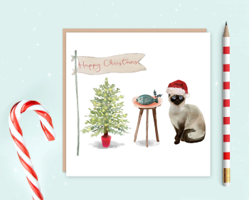 Red and green-themed Christmas card featuring Siamese cat in Christmas hat with roast fish and Christmas tree