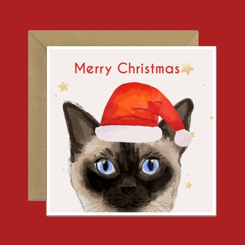 Christmas card featuring a close-up of Siamese cat wearing a Santa hat