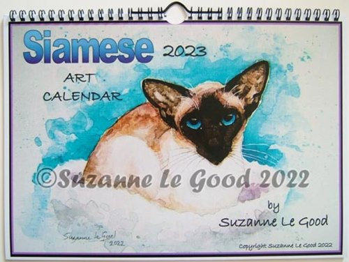 The cover of Suzanne Le Good's Siamese Cat Art Calendar, showing a seal point Siamese cat on a turquoise blue background.