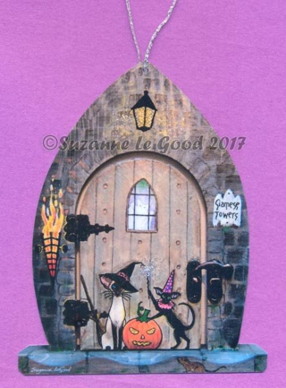 Hanging Halloween sign featuring Siamese and black Oriental cats outside spooky house, by Suzanne Le Good