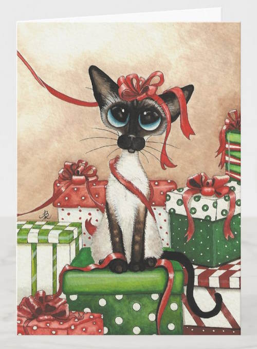 Cute Siamese cat sits on a pile of Christmas packages wrapped in red and green, bedecked in red ribbon and a red bow on his head. Artwork by AmyLyn Bihrle.