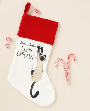 Red and white Christmas stocking featuring Siamese cat hanging off wall with the wording 'Dear Santa, I can explain!'
